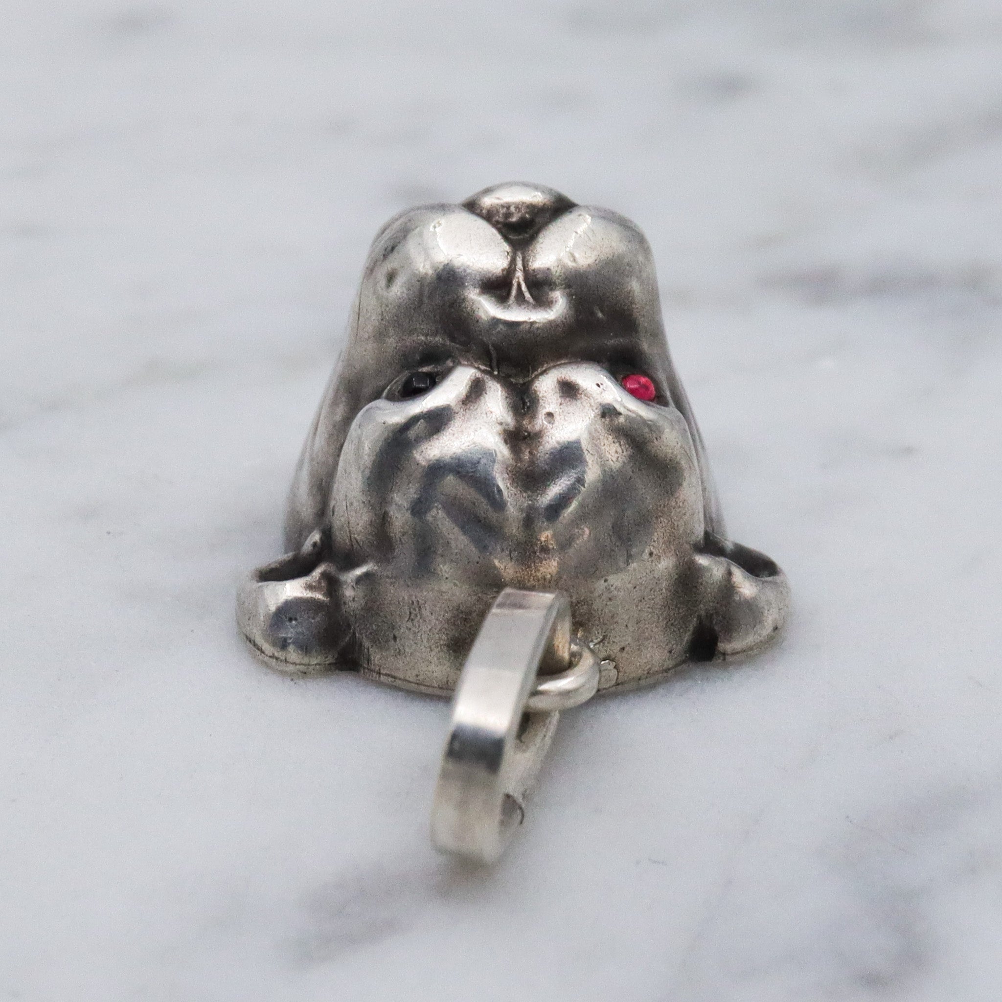 Antique Unger Brothers sterling silver bulldog with ruby glass eyes pendant